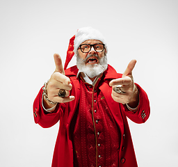 Image showing Modern stylish Santa Claus in red fashionable suit isolated on white background