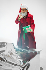 Image showing Modern stylish Santa Claus in red fashionable suit isolated on white background