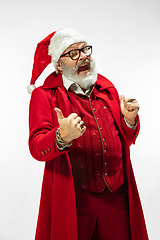 Image showing Modern stylish Santa Claus in red fashionable suit isolated on white background