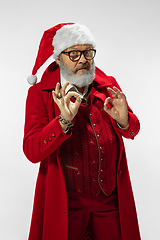 Image showing Modern stylish Santa Claus in red fashionable suit isolated on white background