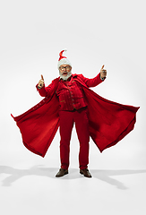 Image showing Modern stylish Santa Claus in red fashionable suit isolated on white background