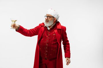 Image showing Modern stylish Santa Claus in red fashionable suit isolated on white background