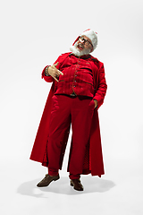 Image showing Modern stylish Santa Claus in red fashionable suit isolated on white background