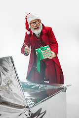 Image showing Modern stylish Santa Claus in red fashionable suit isolated on white background