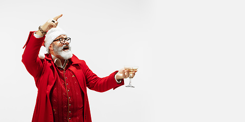 Image showing Modern stylish Santa Claus in red fashionable suit isolated on white background