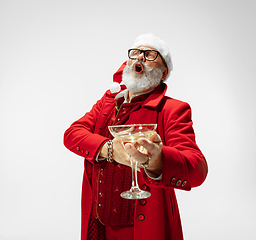 Image showing Modern stylish Santa Claus in red fashionable suit isolated on white background