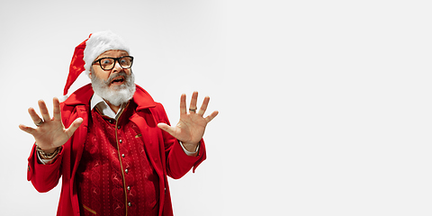 Image showing Modern stylish Santa Claus in red fashionable suit isolated on white background