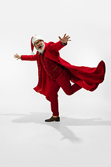 Image showing Modern stylish Santa Claus in red fashionable suit isolated on white background