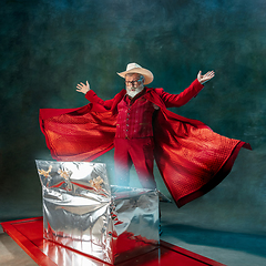 Image showing Modern stylish Santa Claus in red fashionable suit and cowboy\'s hat on dark background