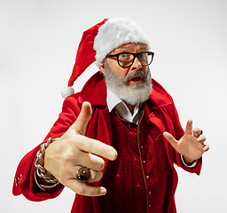 Image showing Modern stylish Santa Claus in red fashionable suit isolated on white background