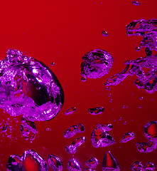 Image showing Close up view of the cold and fresh cola with bright bubbles in neon light