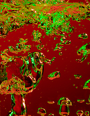 Image showing Close up view of the cold and fresh cola with bright bubbles in neon light