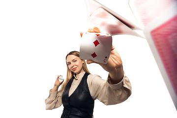 Image showing Poker girl. Young woman, croupier isolated on white background. Highly tensioned, wide angle, fish eye view