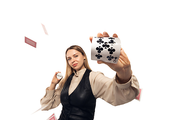 Image showing Poker girl. Young woman, croupier isolated on white background. Highly tensioned, wide angle, fish eye view