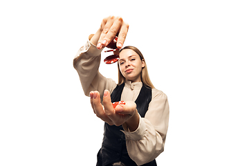 Image showing Poker girl. Young woman, croupier isolated on white background. Highly tensioned, wide angle, fish eye view