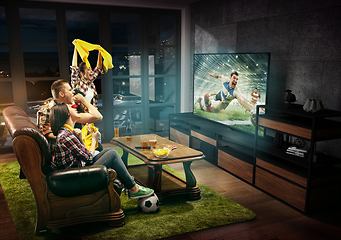 Image showing Group of friends watching rugby match, sport together