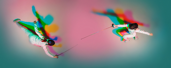 Image showing Teen girl in fencing costume with sword in hand on gradient background with neon light, top view