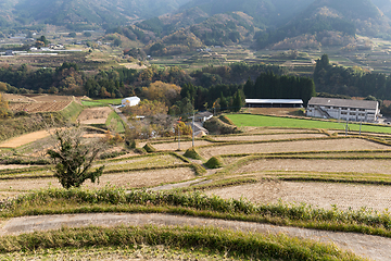 Image showing Harvested field and mountain