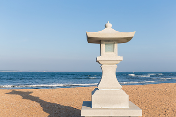 Image showing Stone lantern and sand beach