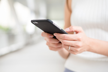 Image showing Close up of Woman use of cellphone