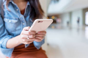 Image showing Woman working on cellphone