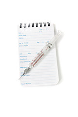 Image showing Medical notebook and syringe needle
