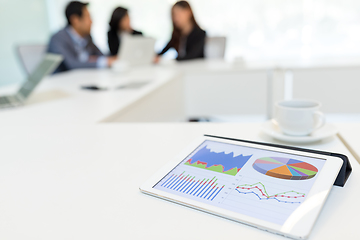 Image showing Digital tablet showing data chart in meeting room