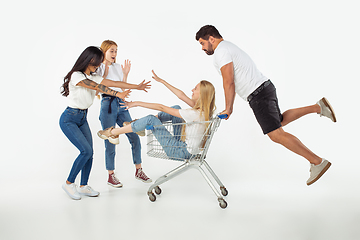 Image showing Group of adorable multiethnic friends having fun isolated over white studio background