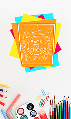 Image showing Colorful school supplies corner border over a white background with words Back to school