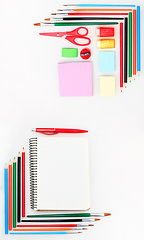 Image showing Colorful school supplies corner border over a white background with negative space