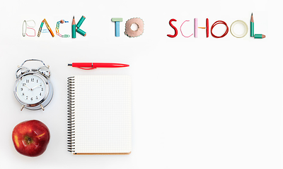 Image showing Colorful school supplies corner border over a white background with words Back to school