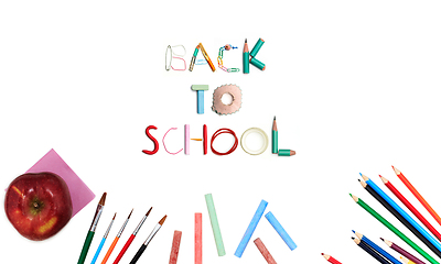 Image showing Colorful school supplies corner border over a white background with words Back to school