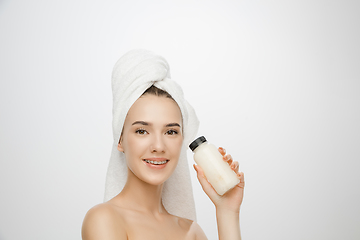 Image showing Beauty Day. Woman wearing towel isolated on white studio background