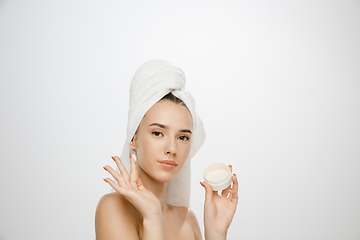 Image showing Beauty Day. Woman wearing towel isolated on white studio background