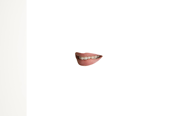 Image showing Close-up view of female mouth wearing lipstick isolated on white studio background