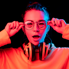 Image showing Caucasian woman\'s portrait isolated on studio background in neon light