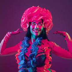 Image showing Caucasian woman\'s portrait isolated on studio background in neon light