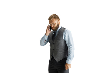 Image showing Cheerful handsome businessman isolated over white studio background