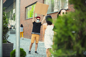 Image showing Dude with sign - man stands protesting things that annoy him