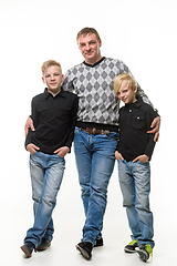 Image showing Full length portrait of father and two sons in casual clothes, isolated on white background