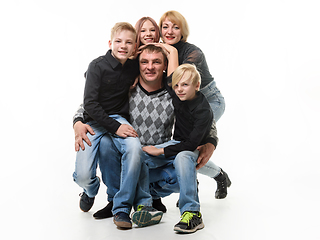 Image showing Children and mom hug happy dad, isolated on white background