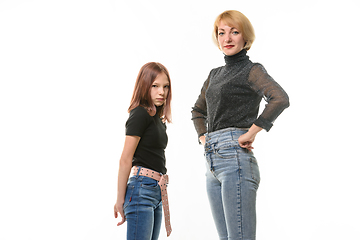 Image showing Upset girl and smiling girl look into the frame, isolated on white background