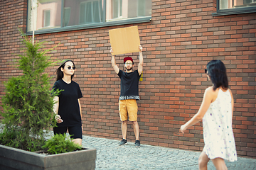 Image showing Dude with sign - man stands protesting things that annoy him