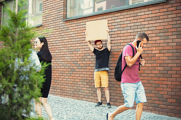 Image showing Dude with sign - man stands protesting things that annoy him