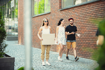 Image showing Dude with sign - woman stands protesting things that annoy her