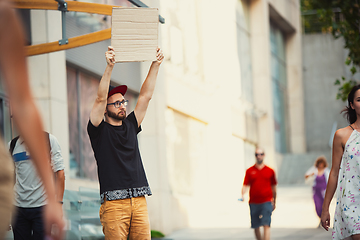 Image showing Dude with sign - man stands protesting things that annoy him