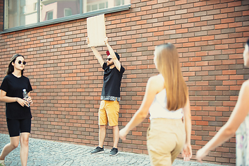 Image showing Dude with sign - man stands protesting things that annoy him