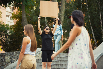 Image showing Dude with sign - woman stands protesting things that annoy her