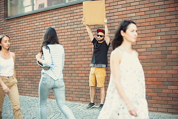 Image showing Dude with sign - man stands protesting things that annoy him