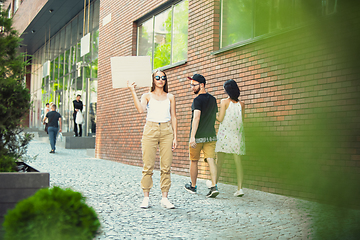 Image showing Dude with sign - woman stands protesting things that annoy her